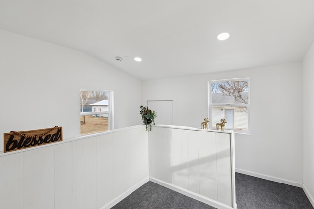 609 2nd Ave NE, Sleepy Eye, MN 56085 - hallway with dark colored carpet, recessed lighting, vaulted ceiling, and baseboards
