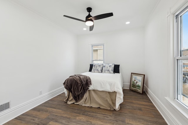 609 2nd Ave NE, Sleepy Eye, MN 56085 - bedroom featuring crown molding, dark wood-style flooring, recessed lighting, baseboards, and ceiling fan