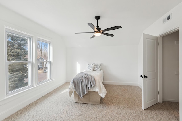 609 2nd Ave NE, Sleepy Eye, MN 56085 - bedroom with lofted ceiling, light colored carpet, baseboards, and ceiling fan