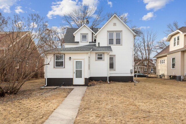 609 2nd Ave NE, Sleepy Eye, MN 56085 - rear view of property with cooling unit and roof with shingles