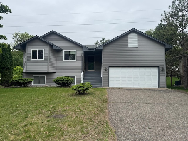 11622 Rio Loma Ln, Burnsville, MN 55337 - view of front of home with driveway, a front lawn, an attached garage, and central AC