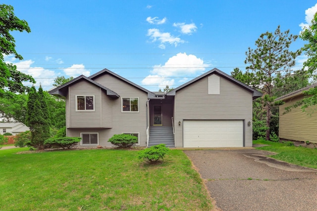 11622 Rio Loma Ln, Burnsville, MN 55337 - view of front of home with asphalt driveway, a garage, and a front lawn