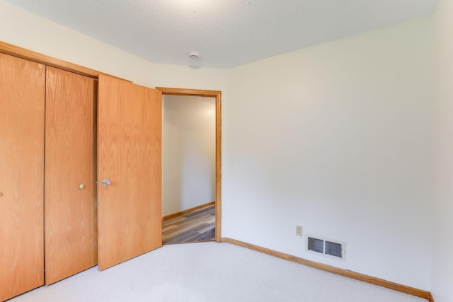 11622 Rio Loma Ln, Burnsville, MN 55337 - unfurnished bedroom with carpet flooring, baseboards, and a closet