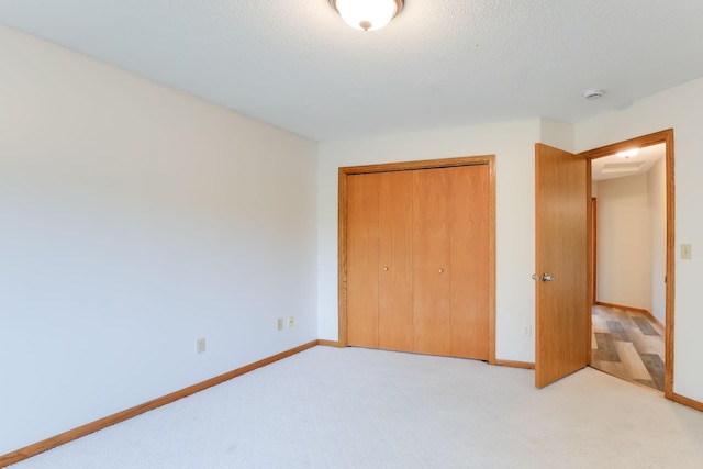 11622 Rio Loma Ln, Burnsville, MN 55337 - unfurnished bedroom with a closet, baseboards, and carpet