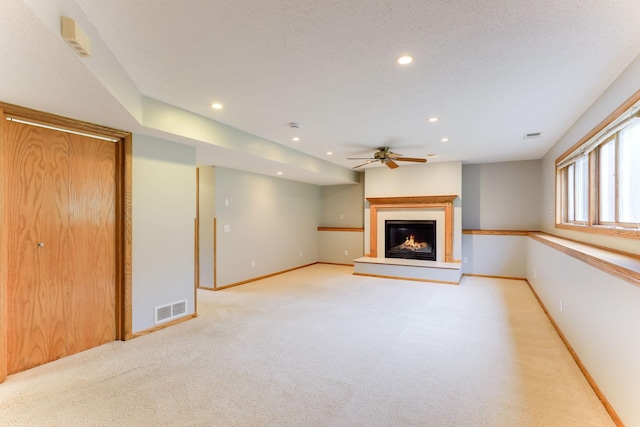 11622 Rio Loma Ln, Burnsville, MN 55337 - unfurnished living room featuring ceiling fan, recessed lighting, a glass covered fireplace, baseboards, and light carpet