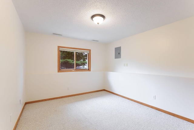 11622 Rio Loma Ln, Burnsville, MN 55337 - carpeted empty room featuring electric panel, a textured ceiling, and baseboards