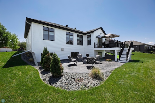 3784 Bell Blvd E, West Fargo, ND 58078 - rear view of house with stairway, a patio, a wooden deck, and a lawn