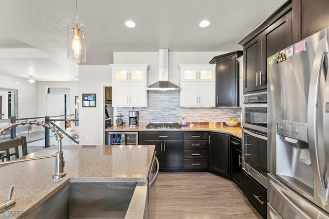 3784 Bell Blvd E, West Fargo, ND 58078 - kitchen featuring stainless steel appliances, a sink, wall chimney range hood, beverage cooler, and backsplash