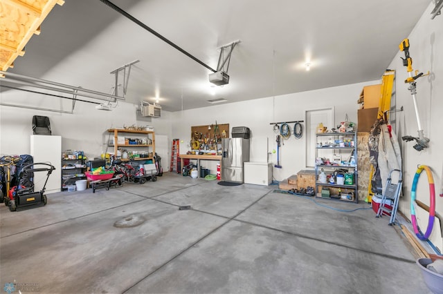 3784 Bell Blvd E, West Fargo, ND 58078 - garage with stainless steel fridge with ice dispenser and a garage door opener