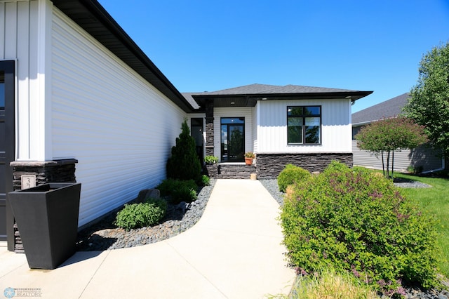 3784 Bell Blvd E, West Fargo, ND 58078 - doorway to property with board and batten siding and stone siding