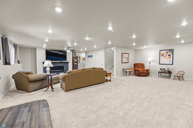 3784 Bell Blvd E, West Fargo, ND 58078 - carpeted living room featuring baseboards, stairs, recessed lighting, and a glass covered fireplace