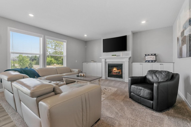 12905 Jewell Cir NE, Blaine, MN 55449 - living room with a fireplace, baseboards, light colored carpet, and recessed lighting