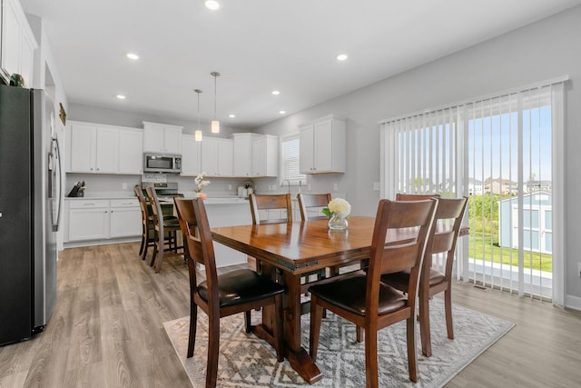 12905 Jewell Cir NE, Blaine, MN 55449 - dining area featuring light wood-style floors and recessed lighting