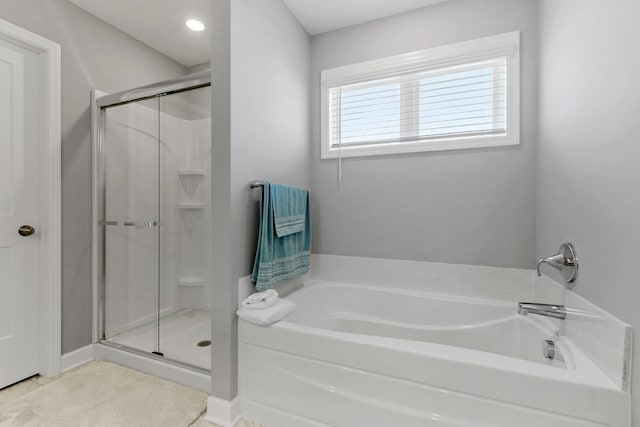 12905 Jewell Cir NE, Blaine, MN 55449 - full bath with a garden tub and a stall shower