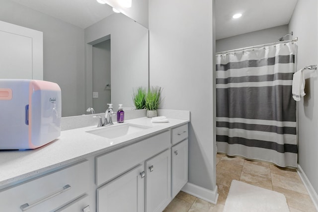 12905 Jewell Cir NE, Blaine, MN 55449 - bathroom featuring vanity, baseboards, and a shower with curtain