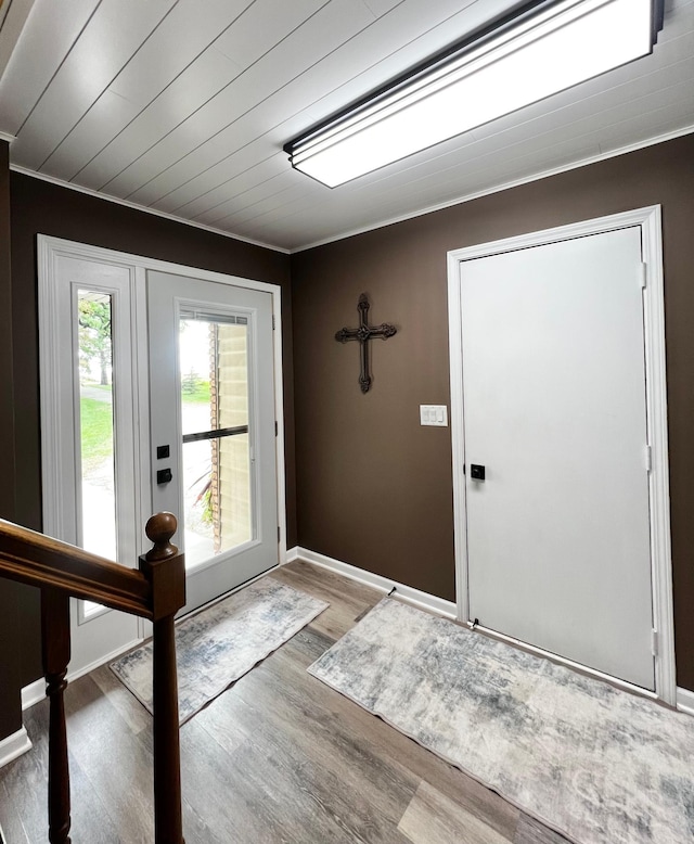 17300 Baseline Ave, Sand Creek Twp, MN 55352 - entryway with ornamental molding, wood finished floors, and baseboards