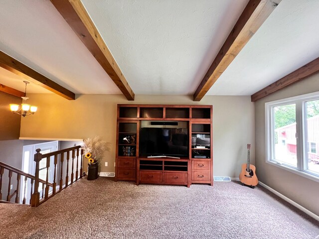 17300 Baseline Ave, Sand Creek Twp, MN 55352 - carpeted living room featuring beamed ceiling, a chandelier, and baseboards