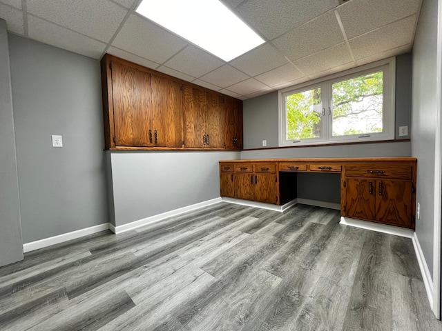 17300 Baseline Ave, Sand Creek Twp, MN 55352 - unfurnished room featuring a paneled ceiling, wood finished floors, and baseboards
