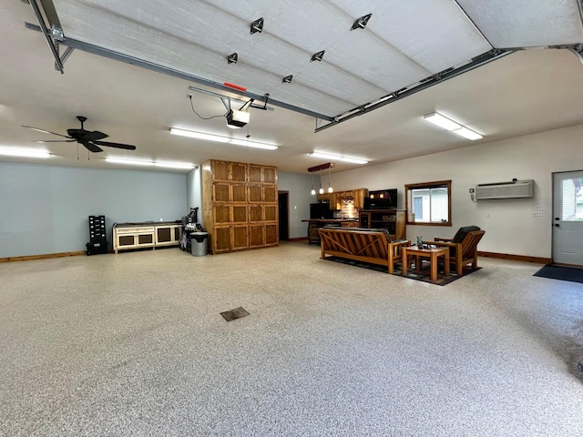 17300 Baseline Ave, Sand Creek Twp, MN 55352 - garage with a wall mounted AC, a garage door opener, and baseboards