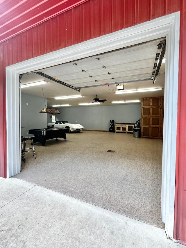 17300 Baseline Ave, Sand Creek Twp, MN 55352 - garage with a garage door opener and wooden walls