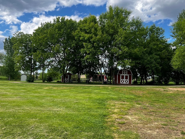 17300 Baseline Ave, Sand Creek Twp, MN 55352 - view of home's community featuring a yard and a barn