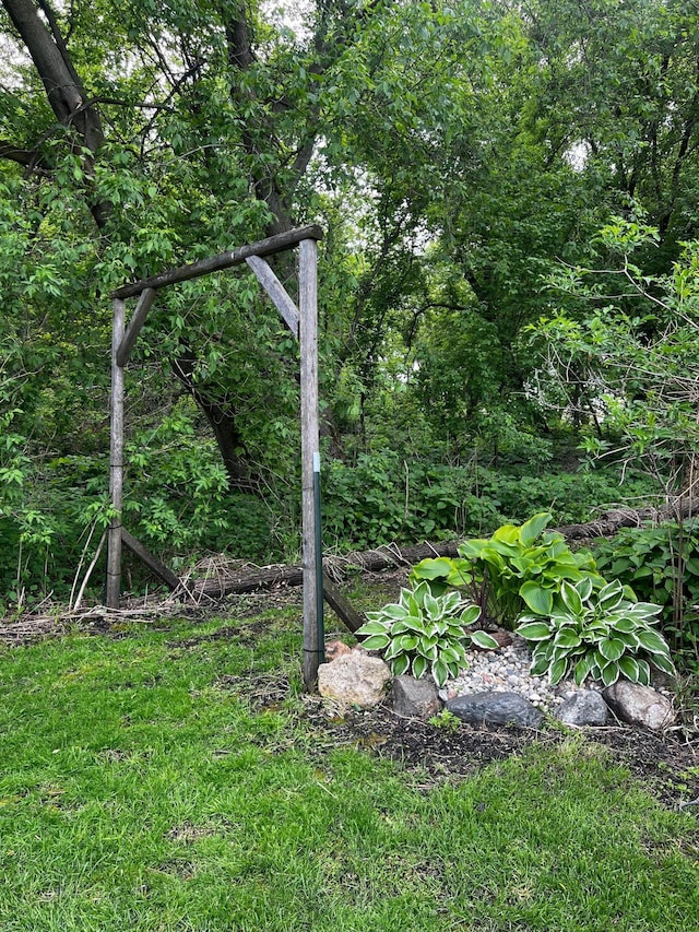 17300 Baseline Ave, Sand Creek Twp, MN 55352 - view of yard featuring a view of trees