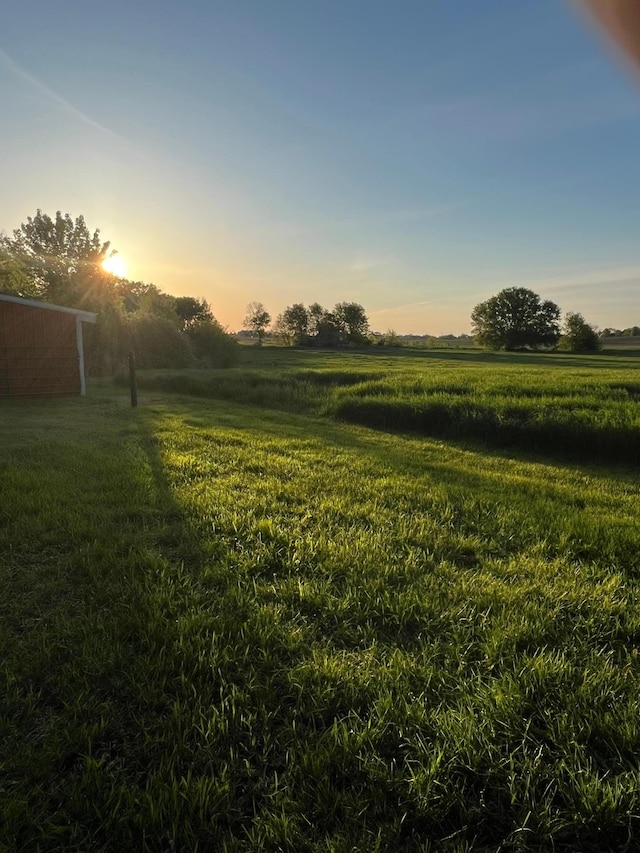 17300 Baseline Ave, Sand Creek Twp, MN 55352 - yard at dusk with a view of rural / pastoral area