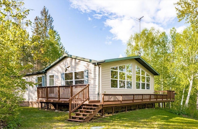2614 Leroy Rd, Eveleth, MN 55734 - rear view of house with a deck and a lawn