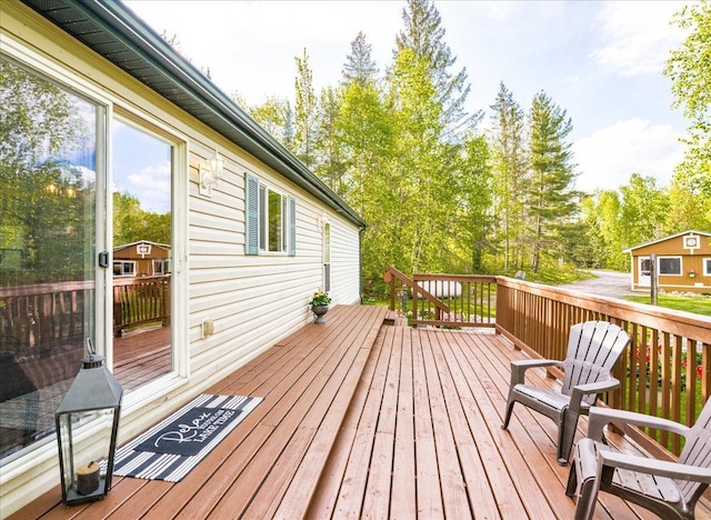 2614 Leroy Rd, Eveleth, MN 55734 - wooden terrace featuring view of scattered trees