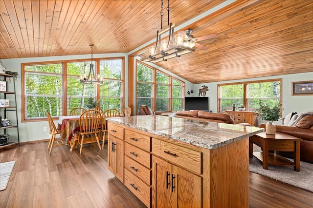 2614 Leroy Rd, Eveleth, MN 55734 - kitchen featuring open floor plan, lofted ceiling, wood ceiling, a chandelier, and a center island