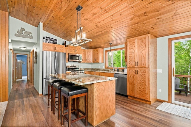 2614 Leroy Rd, Eveleth, MN 55734 - kitchen featuring stainless steel appliances, lofted ceiling, wood ceiling, plenty of natural light, and a kitchen island