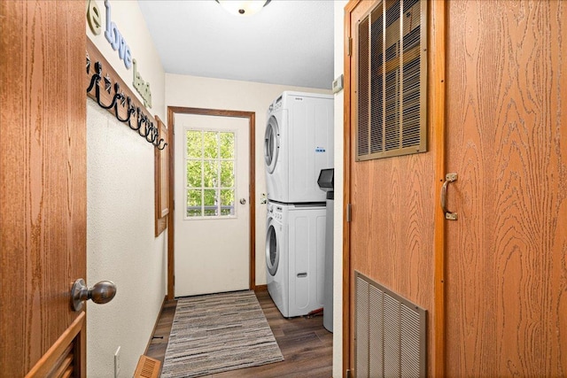 2614 Leroy Rd, Eveleth, MN 55734 - washroom with estacked washer and dryer and wood finished floors