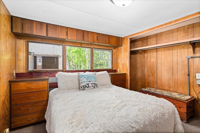 2614 Leroy Rd, Eveleth, MN 55734 - bedroom featuring wood walls, carpet flooring, and a closet