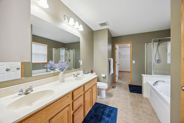 12332 3rd St NE, Blaine, MN 55434 - full bath with a stall shower, a garden tub, double vanity, toilet, and a textured ceiling