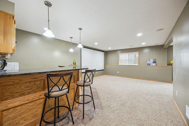 12332 3rd St NE, Blaine, MN 55434 - indoor bar with carpet floors, a textured ceiling, hanging light fixtures, baseboards, and recessed lighting