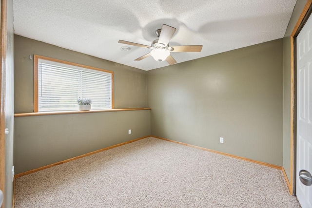 12332 3rd St NE, Blaine, MN 55434 - carpeted empty room featuring a ceiling fan, baseboards, and a textured ceiling
