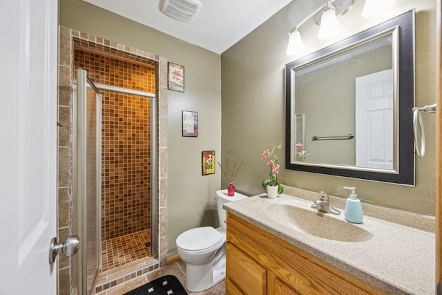 12332 3rd St NE, Blaine, MN 55434 - bathroom featuring toilet, a shower stall, vanity, and tile patterned floors