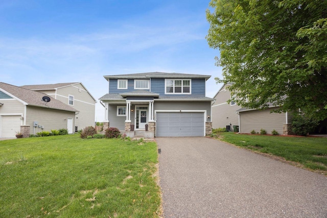12332 3rd St NE, Blaine, MN 55434 - view of front of house featuring stone siding, driveway, an attached garage, and a front yard