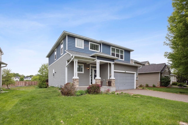 12332 3rd St NE, Blaine, MN 55434 - view of front facade with driveway, covered porch, an attached garage, and stone siding