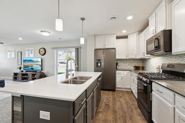 11564 Woodside Dr, Rogers, MN 55311 - kitchen featuring stainless steel appliances, a sink, dark wood-type flooring, decorative backsplash, and recessed lighting