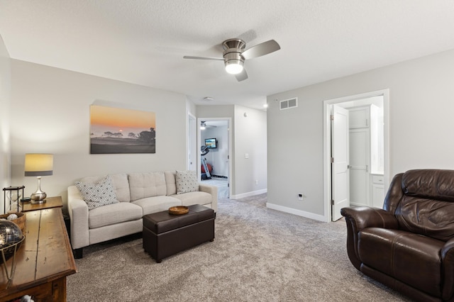 11564 Woodside Dr, Rogers, MN 55311 - living area featuring ceiling fan, carpet flooring, and baseboards