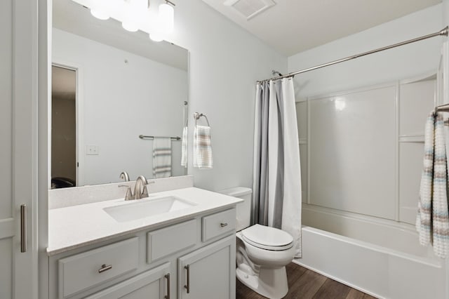 11564 Woodside Dr, Rogers, MN 55311 - full bathroom with vanity, shower / tub combo with curtain, wood finished floors, and toilet