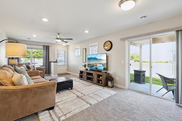 11564 Woodside Dr, Rogers, MN 55311 - carpeted living room featuring a ceiling fan, baseboards, and recessed lighting