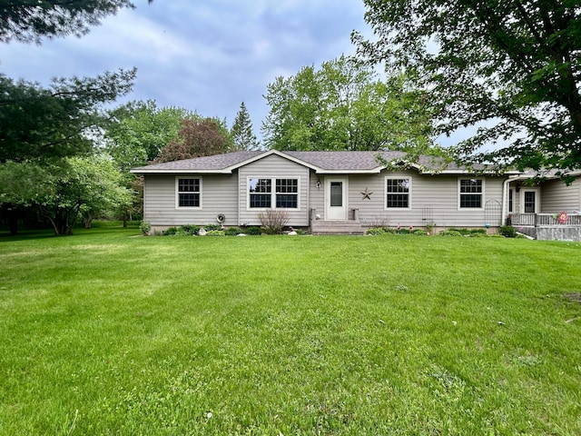 10696 Leaf River Rd, Leaf River Twp, MN 56482 - rear view of property featuring a lawn and roof with shingles
