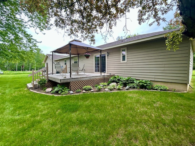 10696 Leaf River Rd, Leaf River Twp, MN 56482 - back of property with a wooden deck and a lawn
