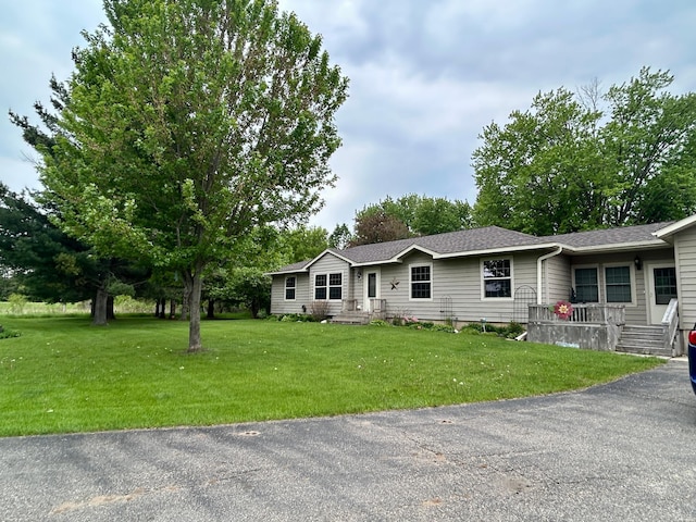 10696 Leaf River Rd, Leaf River Twp, MN 56482 - ranch-style home featuring a front yard and a shingled roof