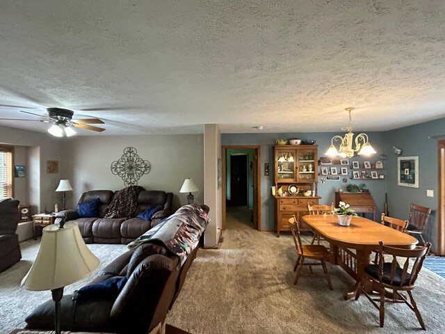 10696 Leaf River Rd, Leaf River Twp, MN 56482 - dining area featuring a textured ceiling, light carpet, a chandelier, and ceiling fan