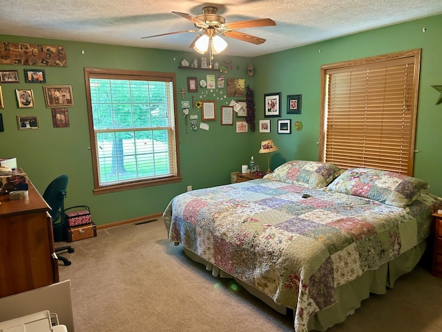 10696 Leaf River Rd, Leaf River Twp, MN 56482 - bedroom with a textured ceiling, light carpet, a ceiling fan, and baseboards