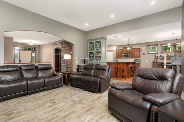 2349 175th Ln NE, Ham Lake, MN 55304 - living room featuring arched walkways, light wood finished floors, and recessed lighting