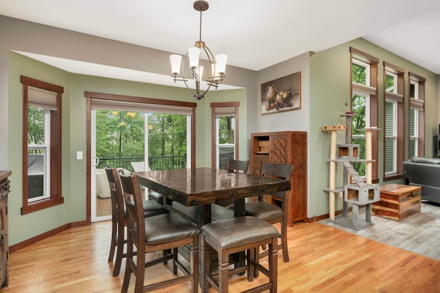 2349 175th Ln NE, Ham Lake, MN 55304 - dining room featuring light wood-type flooring, plenty of natural light, baseboards, and a chandelier